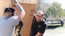 Infinity AC of Austin tech getting a system down from truck